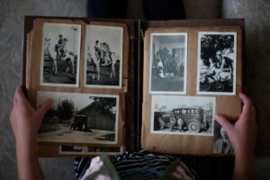 Someone holding an old picture album